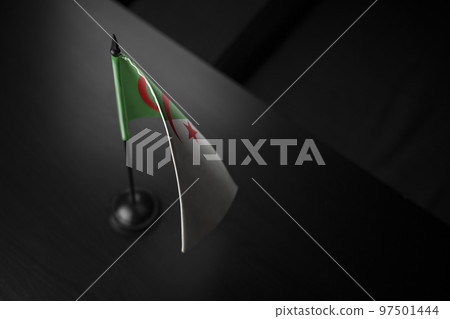 Small national flag of the Algeria on a black background 97501444
