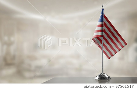 A small Liberia flag on an abstract blurry background 97501517