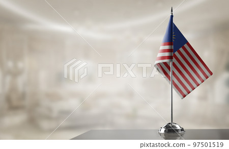 A small Malaysia flag on an abstract blurry background A small Malaysia flag on an abstract blurry background 97501519