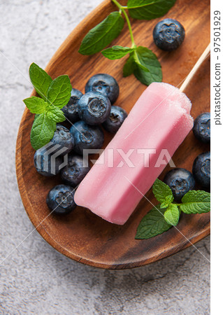 Homemade blueberry ice cream or popsicles 97501929