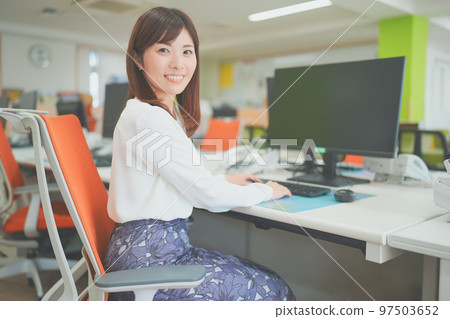 woman doing desk work in the office woman doing desk work in the office 97503652