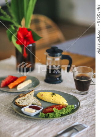 Delicious omelette with tomatoes 97505468