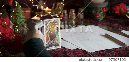 Tarot reader or Fortune teller reading on Christmas decoration. Tarot reader or Fortune teller reading on Christmas decoration. 97507103