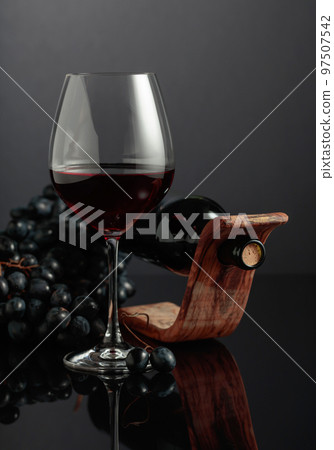 Red wine and blue grapes. Red wine and blue grapes. 97507542