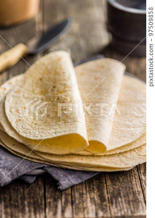 Mexican Corn Tortillas on wooden table. 97509858