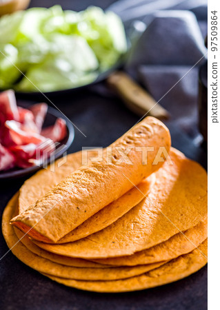 Mexican Corn Tortillas on kitchen table. Mexican Corn Tortillas on kitchen table. 97509864