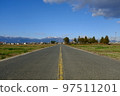 Country road leading to the mountains 97511201