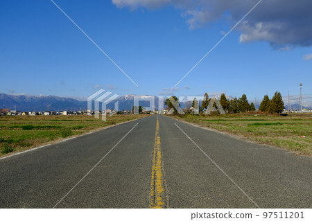 Country road leading to the mountains 97511201