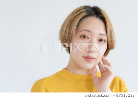 Portrait of a young woman in yellow clothes Portrait of a young woman in yellow clothes 97513252