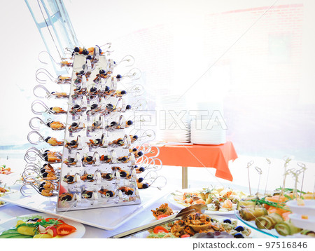 catering table set service with silverware and glass 97516846