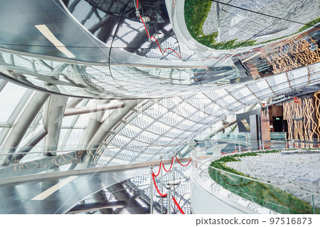 Nur-Alem sphere in EXPO 2017 Exhibition Area. Futuristic Interior. Glass roof with solar panels in exhibition hall with model of Astana city. 97516873