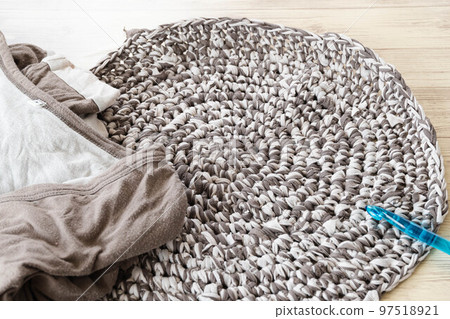 A mat made from worn-out T-shirts A mat made from worn-out T-shirts 97518921