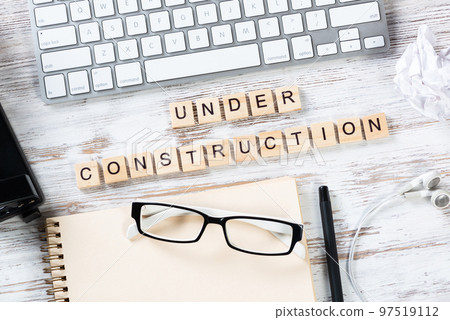 Under construction concept with letters on cubes Under construction concept with letters on cubes 97519112