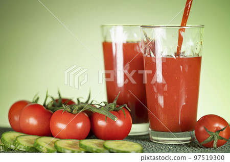 Tomato juice from fresh tomatoes with cucumbers. Healthy food. Vegetarian drink. Tomato juice from fresh tomatoes with cucumbers. Healthy food. Vegetarian drink. 97519300