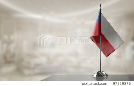 A small Chile flag on an abstract blurry background A small Chile flag on an abstract blurry background 97519876