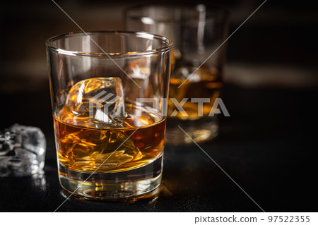 Whiskey with ice in glasses Whiskey with ice in glasses 97522355