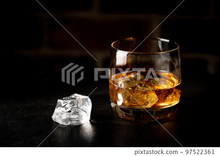 Whiskey with ice in glasses 97522361