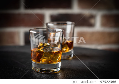 Whiskey with ice in glasses 97522366