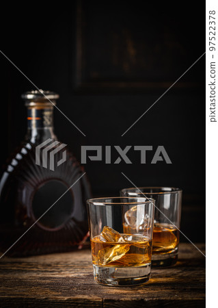 Whiskey with ice in glasses 97522378