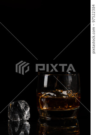 Whiskey with ice in glasses Whiskey with ice in glasses 97522384