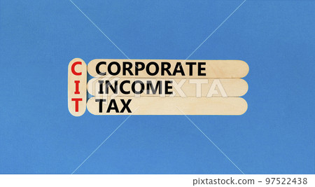CIT corporate income tax symbol. Concept words CIT corporate income tax on wooden sticks on a beautiful blue table blue background. Business and CIT corporate income tax concept. Copy space. CIT corporate income tax symbol. Concept words CIT corporate income tax on wooden sticks on a beautiful blue table blue background. Business and CIT corporate income tax concept. Copy space. 97522438