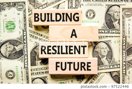 Building a resilient future symbol. Concept word Building a resilient future on wooden blocks. Beautiful background from dollar bills. Business and building a resilient future concept. Copy space. Building a resilient future symbol. Concept word Building a resilient future on wooden blocks. Beautiful background from dollar bills. Business and building a resilient future concept. Copy space. 97522446