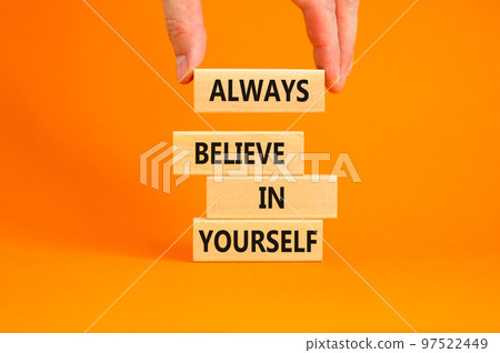 Always believe in yourself symbol. Concept words Always believe in yourself on wooden blocks on beautiful orange background. Businessman hand. Business motivational always believe in yourself concept. Always believe in yourself symbol. Concept words Always believe in yourself on wooden blocks on beautiful orange background. Businessman hand. Business motivational always believe in yourself concept. 97522449