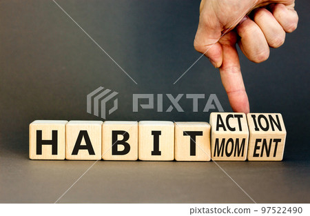 Habit action and moment symbol. Concept words Habit action Habit moment on wooden cubes. Businessman hand. Beautiful grey table grey background. Business habit action moment concept. Copy space. Habit action and moment symbol. Concept words Habit action Habit moment on wooden cubes. Businessman hand. Beautiful grey table grey background. Business habit action moment concept. Copy space. 97522490