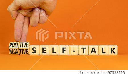 Positive or negative self-talk symbol. Concept words Positive self-talk and Negative self-talk on cubes. Beautiful orange background. Psychological positive or negative self-talk concept. Copy space. 97522513