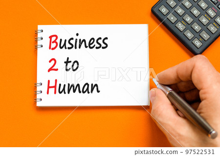 B2H business to human symbol. Concept words B2H business to human on white note on a beautiful orange table orange background. Businessman hand. Business and B2H business to human concept. Copy space. B2H business to human symbol. Concept words B2H business to human on white note on a beautiful orange table orange background. Businessman hand. Business and B2H business to human concept. Copy space. 97522531