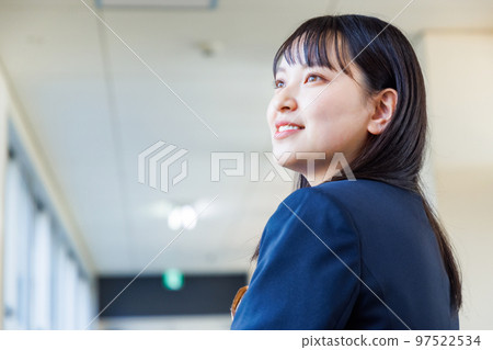 High school girl in uniform walking in the corridor 97522534
