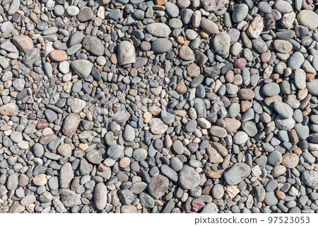 Gray coastal pebble, top view, close-up background texture Gray coastal pebble, top view, close-up background texture 97523053