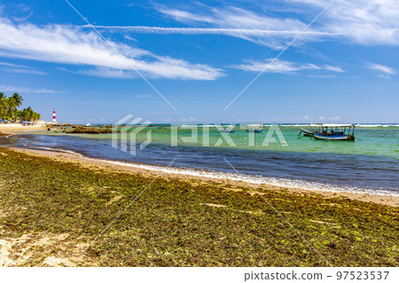 Beach and lighthouse of Itapua in Salvador Beach and lighthouse of Itapua in Salvador 97523537