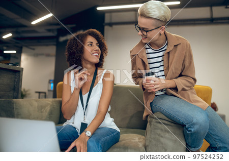Corporate employees discussing a business project during the coffee break 97524252
