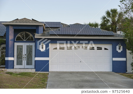 Wide garage double door and concrete driveway of new modern american house 97525640