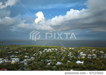 View from above of large residential houses in island small town Boca Grande on Gasparilla Island in southwest Florida. American dream homes as example of real estate development in US suburbs 97525682