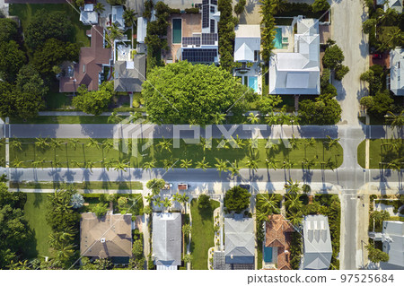View from above of large residential houses in closed living golf club in south Florida. American dream homes as example of real estate development in US suburbs 97525684