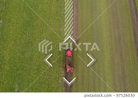 Autonomous harvester on the sugar beet field. Autonomous harvester on the sugar beet field. 97526030