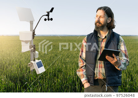Farmer control weather station via mobile app.  97526048