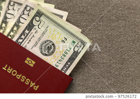 Travel passport and money, American dollars banknotes bills on copy space background, top view. Traveling and finance problems concept. 97526172
