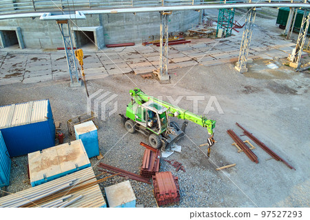 Lifting crane tractor on industrial construction site. Heavy duty machinery for building industry 97527293