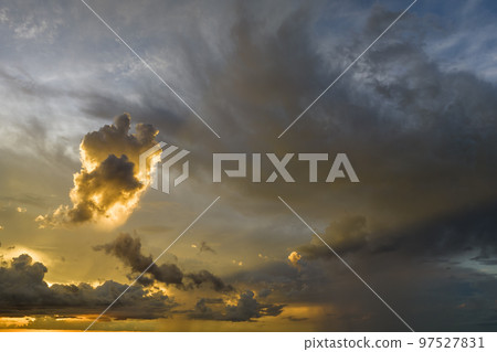 Cumulonimbus clouds forming before thunderstorm on evening sky. Changing stormy cloudscape weather at sunset Cumulonimbus clouds forming before thunderstorm on evening sky. Changing stormy cloudscape weather at sunset 97527831