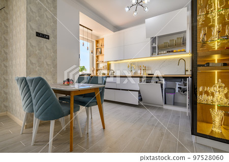 A contemporary white kitchen with extended drawers 97528060