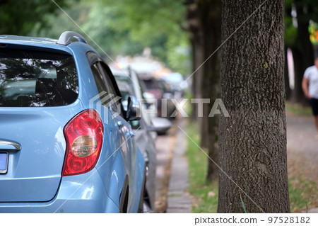 Close up of a car parked on city street side. Urban traffic concept 97528182