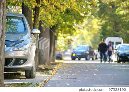 Close up of a car parked illegally against traffic rules on pedestrian city street side 97528190
