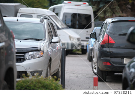 Cars parked in line on city street side. Urban traffic concept Cars parked in line on city street side. Urban traffic concept 97528211