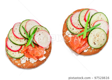Cracker Sandwiches with Salmon, Cucumber, Radish, Cottage Cheese and Green Onions - Isolated Cracker Sandwiches with Salmon, Cucumber, Radish, Cottage Cheese and Green Onions - Isolated 97528616