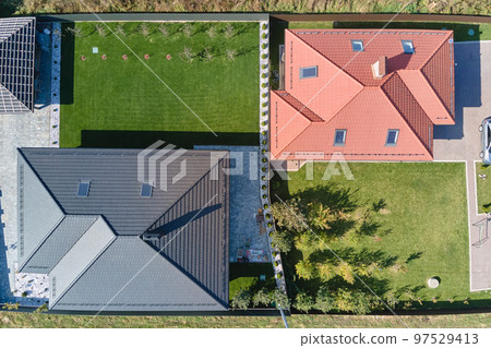 Aerial view of residential house with backyard in suburban rural area 97529413