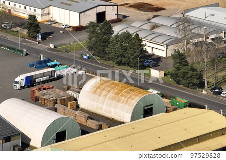 Aerial view of goods warehouses and logistics center in industrial city zone from above Aerial view of goods warehouses and logistics center in industrial city zone from above 97529828