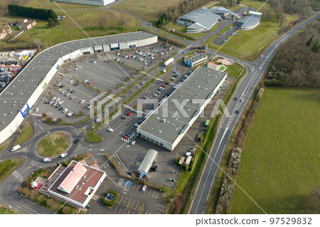 Aerial view of goods warehouses and logistics center in industrial city zone from above Aerial view of goods warehouses and logistics center in industrial city zone from above 97529832